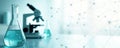 Glass flask, microscope with blue liquid in lab with data graph background. Medical science, research, analysis, experimentation Royalty Free Stock Photo