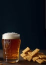 glass of foamy beer, National beer day, dark background, place for text