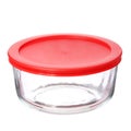 Glass food container with red plastic lid on white Royalty Free Stock Photo