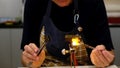 Glass forming and glass workshop in flame. special designs such as beads, flowers, animal figures are made by melting glass stick