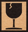 glass of fragile symbol on cardboard