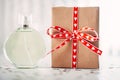 Glass fragrant perfume bottle with red gift box.