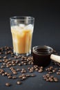 Glass of Frappuccino with ice and glass coffee scoop