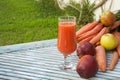 A glass of fresh apple carrot juice