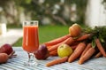 A glass of fresh apple carrot juice