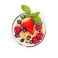 Glass of fresh berries with muesli isolated on white background top view Royalty Free Stock Photo