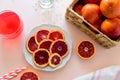 Glass of fresh blood orange juice on pink background. Selective focus Royalty Free Stock Photo