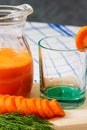 Glass of fresh carrot juice, dill sprigs, sliced carrots Royalty Free Stock Photo