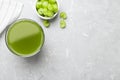 Glass of fresh celery juice on grey table, flat lay. Space for text Royalty Free Stock Photo