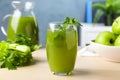 Glass of fresh celery juice on white table, closeup Royalty Free Stock Photo