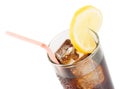Glass of fresh coke with straw with lemon slice on top, summer time Royalty Free Stock Photo