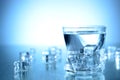 Glass of fresh cool water and ice cubes on table Royalty Free Stock Photo