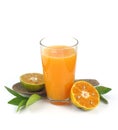 Glass of fresh and delicious orange juice with half of orange and leaves on white background Royalty Free Stock Photo