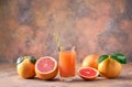 Glass of fresh grapefruit juice on a abstract background Royalty Free Stock Photo