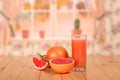 A glass of fresh grapefruit juice, half grapefruit, slice and th Royalty Free Stock Photo