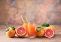 Two glass of fresh grapefruit juice on a abstract background. Royalty Free Stock Photo