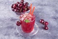 Glass with fresh homemade cherry sweet iced tea or cocktail, lemonade with mint. Refreshing cold drink. Summer party Royalty Free Stock Photo