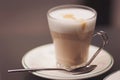 Glass of fresh hot aromatic latte coffee served on table. Frothy cappuccino Royalty Free Stock Photo