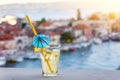Glass of fresh lemonade with Omis Riviera view at sunset, Croatia