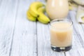 Glass with fresh made Banana juice Royalty Free Stock Photo