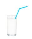 Glass of fresh milk with blue drinking straw. Isolated. Royalty Free Stock Photo