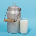Glass of fresh milk and milk canister Royalty Free Stock Photo