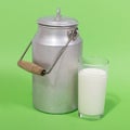 Glass of fresh milk and milk canister Royalty Free Stock Photo