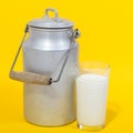 Glass of fresh milk and milk canister Royalty Free Stock Photo