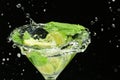 Glass of fresh mojito with splashes on dark background, closeup Royalty Free Stock Photo
