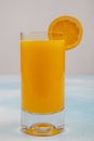 Glass of fresh orange juice with fresh fruits on wooden table Royalty Free Stock Photo