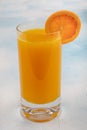 Glass of fresh orange juice with fresh fruits on wooden table Royalty Free Stock Photo