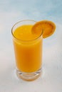 Glass of fresh orange juice with fresh fruits on wooden table Royalty Free Stock Photo