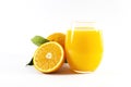 Glass of fresh orange juice with fruits cut in half and sliced with green leaf isolated on white background, clipping path Royalty Free Stock Photo