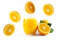 Glass of fresh orange juice with fruits cut in half and sliced with green leaf isolated on white background, clipping path Royalty Free Stock Photo