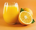 Glass of fresh orange juice with fruits cut in half and sliced with green leaf isolated on white background, clipping path Royalty Free Stock Photo