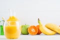 A glass of fresh orange juice and fruits