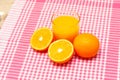 A glass of fresh orange juice and oranges on the table Royalty Free Stock Photo