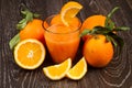 Glass of fresh orange juice and oranges Royalty Free Stock Photo