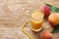 Glass of fresh peach juice and ripe fruits Royalty Free Stock Photo