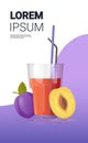 Glass of fresh plum juice with straw and sliced fruits vertical copy space