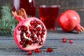 A glass of fresh pomegranate juice with ripe pomegranate fruits Royalty Free Stock Photo