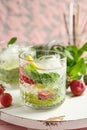 Glass of fresh strawberry lemonade on wooden board Royalty Free Stock Photo