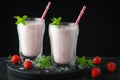 Glass of fresh strawberry shake, smoothie or milkshake and fresh strawberries on table. Healthy food and drink concept with juicy Royalty Free Stock Photo