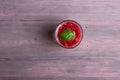 Glass of fresh strawberry smoothie and fresh strawberries on pink wooden background. Healthy food and drink concept Royalty Free Stock Photo