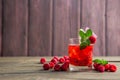 Glass of fresh strawberry smoothie and fresh strawberries on pink wooden background. Healthy food and drink concept Royalty Free Stock Photo