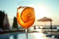 Glass of fresh summer cocktail at poolside outdoors at sunset Royalty Free Stock Photo