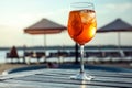 Glass of fresh summer cocktail on wooden table near swimming pool outdoors Royalty Free Stock Photo