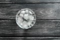 Glass of fresh water with ice cubes on wooden table Royalty Free Stock Photo