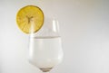 Glass of fresh water with lemon on wooden table close up Royalty Free Stock Photo