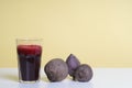 Glass of freshbeetroot smoothie on table, next to red beetroot herb Royalty Free Stock Photo